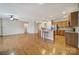 Spacious living room next to kitchen featuring hardwood floors and natural light at 1001 Mesa Verde Dr, Fort Mill, SC 29707