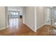 Bright living room featuring hardwood floors, a fireplace, large windows and open floor plan at 1001 Mesa Verde Dr, Fort Mill, SC 29707