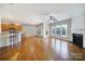 Bright living room and kitchen with hardwood floors, natural light, and stylish decor at 1001 Mesa Verde Dr, Fort Mill, SC 29707
