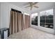 Bright sunroom with tiled floors, ceiling fan, and lots of natural light through windows at 1001 Mesa Verde Dr, Fort Mill, SC 29707