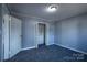 Neutral bedroom with new carpet, ceiling light, closet space, and freshly painted light gray walls at 111 Courtland St, Chester, SC 29706