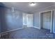 Neutral bedroom with new carpet, ceiling light, closet space, and freshly painted light gray walls at 111 Courtland St, Chester, SC 29706