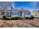 Charming single-story home with blue shutters, manicured bushes, brick chimney, and inviting front entrance at 111 Courtland St, Chester, SC 29706