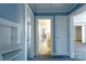 View of a hallway with fresh light blue paint, gray carpet and white trim and doors at 111 Courtland St, Chester, SC 29706