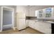 Functional kitchen space with updated sink and faucet, bright natural light and a large refrigerator at 111 Courtland St, Chester, SC 29706