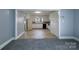 View of a kitchen featuring neutral walls, vintage appliances, and white cabinets at 111 Courtland St, Chester, SC 29706