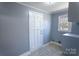 This functional laundry area has storage cabinets, a window, and vinyl flooring at 111 Courtland St, Chester, SC 29706