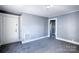 Living room with gray carpet, white trim, and light blue walls at 111 Courtland St, Chester, SC 29706