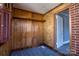 Charming room with wood paneling, new carpet, brick accent, and natural light from multiple windows at 111 Courtland St, Chester, SC 29706