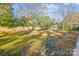 Large backyard featuring a gazebo, fence, and mature trees at 137 Lancaster St, Chester, SC 29706