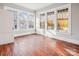Bright living room featuring hardwood floors and plenty of windows with natural light at 137 Lancaster St, Chester, SC 29706