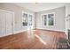 Bright living room featuring hardwood floors, large windows and a door to the outside at 137 Lancaster St, Chester, SC 29706