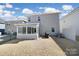 A full view of the backyard and its surrounding homes, featuring a well-kept lawn at 14032 Canemeadow Dr, Charlotte, NC 28278