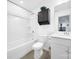 Well-lit bathroom features a shower-tub combo, stylish cabinetry, and modern fixtures at 14032 Canemeadow Dr, Charlotte, NC 28278
