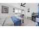 Lively bedroom with a vibrant accent wall, framed pictures, a cozy bed, and window views at 14032 Canemeadow Dr, Charlotte, NC 28278