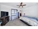This bedroom features bright blue accents, a stylish TV stand, and ample space for a relaxing retreat at 14032 Canemeadow Dr, Charlotte, NC 28278