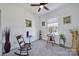 Serene bedroom features a cozy rocking chair, carpeted floors, and a bright window view at 14032 Canemeadow Dr, Charlotte, NC 28278