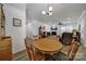 Cozy dining area adjacent to living room with hardwood floors at 14032 Canemeadow Dr, Charlotte, NC 28278