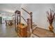 Elegant entryway featuring hardwood floors and staircase with wood and white accents at 14032 Canemeadow Dr, Charlotte, NC 28278