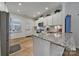 Modern kitchen with stainless steel appliances, granite countertops, and bright lighting at 14032 Canemeadow Dr, Charlotte, NC 28278