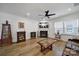 Comfortable living room with fireplace and a large window for natural light at 14032 Canemeadow Dr, Charlotte, NC 28278