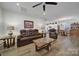 Open-concept living room that connects to the kitchen and dining area at 14032 Canemeadow Dr, Charlotte, NC 28278
