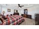 Spacious main bedroom with carpet, ceiling fan, and large dresser at 14032 Canemeadow Dr, Charlotte, NC 28278