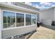 Exterior view of the sunroom addition and the well-maintained backyard at 14032 Canemeadow Dr, Charlotte, NC 28278