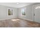 Bright living room with natural light, featuring wood floors and neutral wall paint at 1916 7Th Nw Ave, Hickory, NC 28601