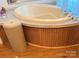 Spacious bathtub with wood paneling and tile surround, perfect for relaxation at 2084 W Memorial Hwy Rd, Union Grove, NC 28689
