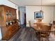 Cozy dining room features a wooden hutch, round table, and durable vinyl plank flooring at 2084 W Memorial Hwy Rd, Union Grove, NC 28689