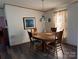 Charming dining area with a classic wooden table and chairs under a vintage stained glass pendant lamp at 2084 W Memorial Hwy Rd, Union Grove, NC 28689