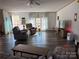 Comfortable living room with plush recliners, wood-look floors, and natural light at 2084 W Memorial Hwy Rd, Union Grove, NC 28689