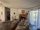 A cozy living room with a fireplace and furniture with floral patterns at 2084 W Memorial Hwy Rd, Union Grove, NC 28689