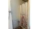 Functional shower with floral curtain and storage rack, offering convenience at 2084 W Memorial Hwy Rd, Union Grove, NC 28689