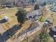 Aerial view displaying the home's driveway, shed, mature trees, and an outbuilding at 2297 Blossom Dr, Rock Hill, SC 29730
