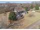 Aerial view of a single-story white home with solar panels on a spacious lot at 2297 Blossom Dr, Rock Hill, SC 29730