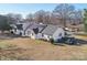 Aerial view of a single-story white home with solar panels on a spacious lot at 2297 Blossom Dr, Rock Hill, SC 29730