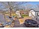 Spacious deck with a fire pit, chairs, and a view of the backyard at 2297 Blossom Dr, Rock Hill, SC 29730