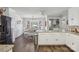 Open dining area with dark hardwood floors, modern light fixture, and backyard view at 2297 Blossom Dr, Rock Hill, SC 29730