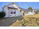 Charming white brick home with large windows and professionally landscaped yard at 2297 Blossom Dr, Rock Hill, SC 29730
