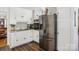 Bright kitchen featuring stainless steel refrigerator, white cabinets, and granite countertops at 2297 Blossom Dr, Rock Hill, SC 29730