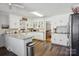 Bright kitchen with white cabinets, granite countertops, and modern stainless steel appliances at 2297 Blossom Dr, Rock Hill, SC 29730