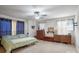 Cozy main bedroom with a mounted TV, soft carpet, and a comfortable bed, perfect for relaxing at 2297 Blossom Dr, Rock Hill, SC 29730
