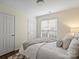 Bedroom features neutral colored walls, wood-look flooring, and a window at 2405 Ivy Run Dr, Indian Trail, NC 28079