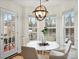 Bright dining area features four windows and hardwood floors at 2405 Ivy Run Dr, Indian Trail, NC 28079