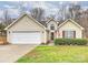 Charming home with a well-maintained lawn and attached two-car garage at 2405 Ivy Run Dr, Indian Trail, NC 28079