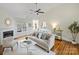 Open living space with fireplace, hardwood floors, and a neutral color palette at 2405 Ivy Run Dr, Indian Trail, NC 28079