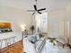 Cozy living room featuring hardwood floors, neutral decor, and lots of light at 2405 Ivy Run Dr, Indian Trail, NC 28079