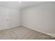 Cozy bedroom with carpet and a door to another room at 2656 Tillman St, Monroe, NC 28112
